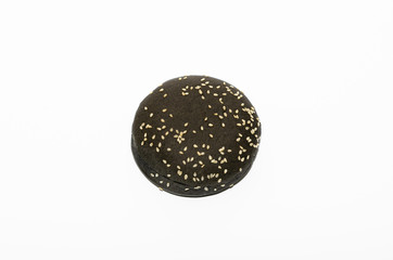 Black burger bun on a white background
