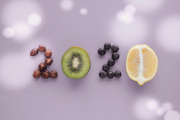 2020 made from healthy food on pastel  purple background, Healhty New year resolution diet and lifestyle