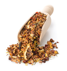 Heap of dried fruit tea infusion with oranges and strawberries mixed with tea leaves and herbs in wooden scoop over white background