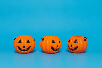 Halloween pumpkin on a blue background and copy space, side view
