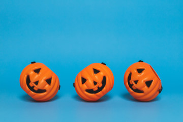 Halloween pumpkin on a blue background and copy space, side view