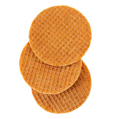 Dutch Caramel waffles with caramel and honey isolated on white background. Round stroopwafel Top view.