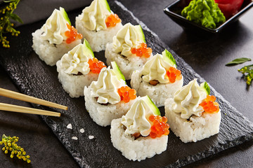 Roll with cream cheese cap, caviar and cucumber