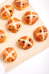 Buns marked with a cross and containing dried fruit, traditionally eaten during Lent.