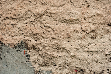 Texture of a concrete wall with cracks and scratches which can be used as a background