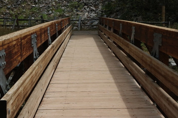 Fototapeta na wymiar wooden bridge, view down center
