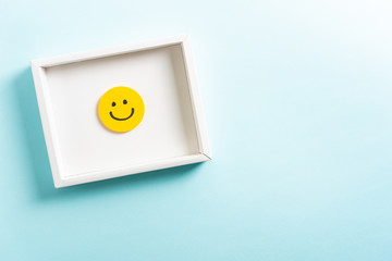 Concept of well done, feedback, employee recognition award. happy yellow smiling cartoon face frame...