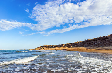 Fototapeta na wymiar Empty beach with small waves