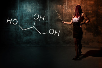 Sexy girl or secretary or female student presenting handdrawn chemical formula of Glycerol