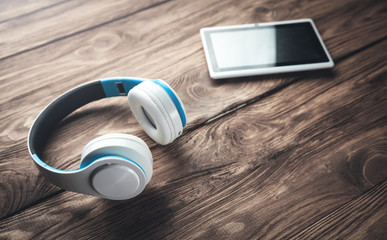 Modern wireless headphones with tablet computer.