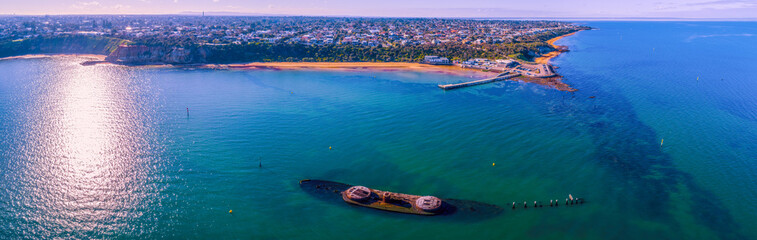 Historic shipwreck near Black Rock coastline in Melbourne, Australia - wide aerial panorama