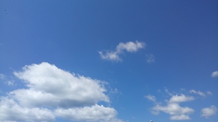 Fluffy White Clouds With Blue Sky Background