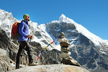 Hiker walking in the mountains, freedom and happiness, achievement in mountains. Himalayas, Nepal