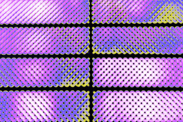 Abstract texture of pink luminous blur lamps on a black background.