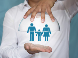 The concept of family safety, health, life. Dad, mom and baby.