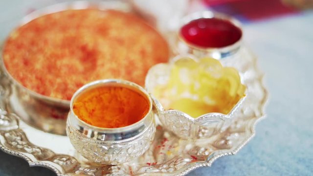 Beautifully Decorated Pooja Thali for festival celebration to worship, haldi or turmeric powder and kumkum, in silver plate
