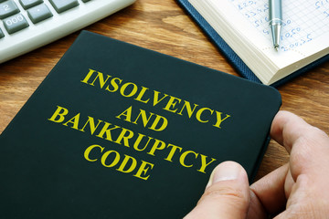 Man holds Insolvency and bankruptcy code IBC. - obrazy, fototapety, plakaty