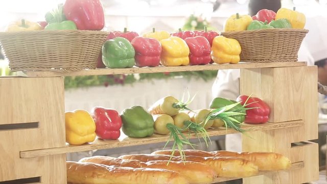 Healthy Vegetables, green capsicum red capsicum yellow capsicum and radish glassy and smooth skin on decorated table  