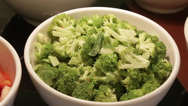 Healthy vigetable  chopped broccoli in the white bowl  