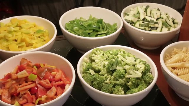 Healthy vigetables chopped green capsicum red tomato pasta cabbage red tomato sauce and keera more   