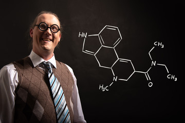 Professor presenting handdrawn chemical formula of LSD