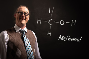 Professor presenting handdrawn chemical formula of Methanol