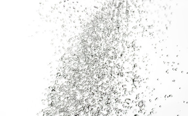 splashes, jets and drops of water hovering in the air on a white background