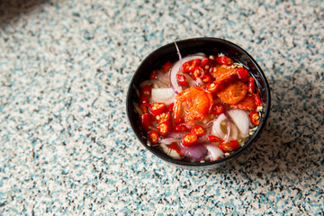 Spicy green mango salad with blue crab in bowl glass. Spicy mango salad with sauce. Delicious...