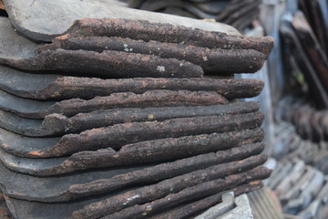 Piles of Javanese house tiles are no longer in obsolete: rural house tiles in Suruh Semarang Regency, Central Java, Indonesia