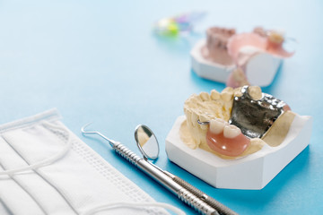  Removable partial denture (RPD.) on blue background.