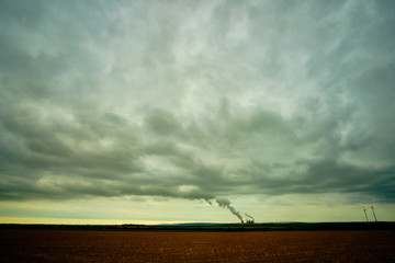 Fototapeta na wymiar Power Plant Scenes in front of a wild morning sky