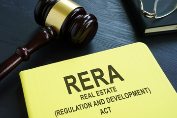 RERA or Real Estate Regulation and Development Act on the desk.