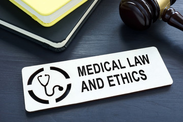 Plate with sign Medical law and ethics.