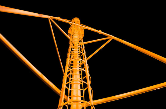 Ladder on a lightning rod against the night sky
