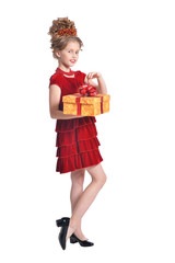 Portrait of cute girl in red dress holding gift box