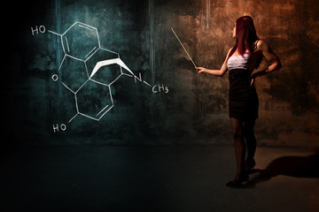 Sexy girl or secretary or female student presenting handdrawn chemical formula of Morphine