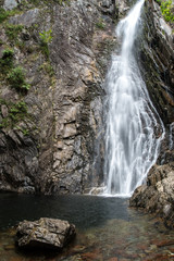 Fototapeta na wymiar waterfall in forest in northwest Scotland