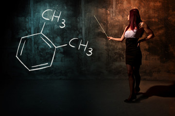 Sexy girl or secretary or female student presenting handdrawn chemical formula of Ortho-xylene...