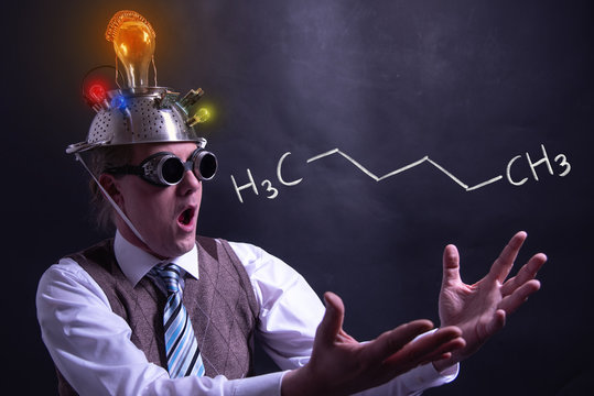 Nerd presenting handdrawn chemical formula of formic hexane