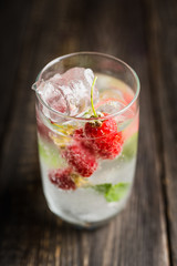 Raspberry mojito cocktail on the rustic background. Selective focus. Shallow depth of field.