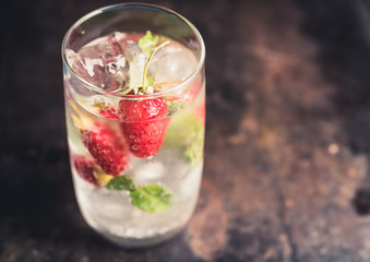 Raspberry mojito cocktail on the rustic background. Selective focus. Shallow depth of field.