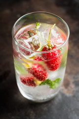 Raspberry mojito cocktail on the rustic background. Selective focus. Shallow depth of field.