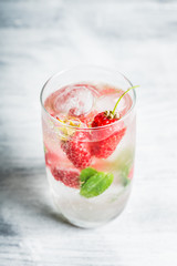Raspberry mojito cocktail on the rustic background. Selective focus. Shallow depth of field.