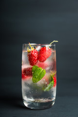 Raspberry mojito cocktail on the rustic background. Selective focus. Shallow depth of field.
