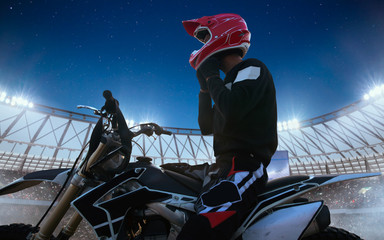 Motofreestyle on professional stadium in night. Fmx. Motocross.