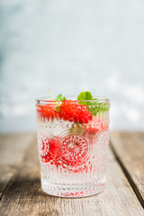 Old fashioned raspberry cocktail. Selective focus. Shallow depth of field.