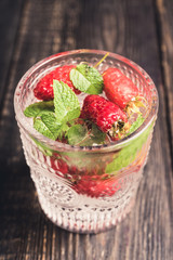 Old fashioned raspberry cocktail. Selective focus. Shallow depth of field.