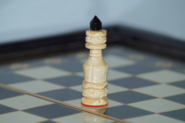 white chess pawn on a chessboard