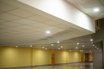 spacious hall with large yellow doors