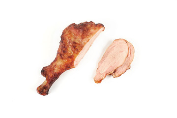 roast turkey leg and sliced turkey meat isolated on white background.
